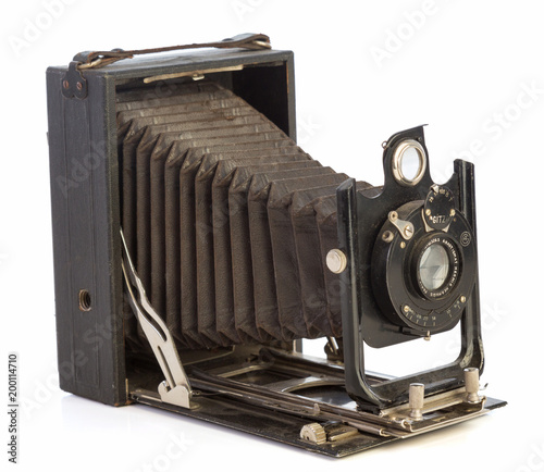 Old black camera with bellows