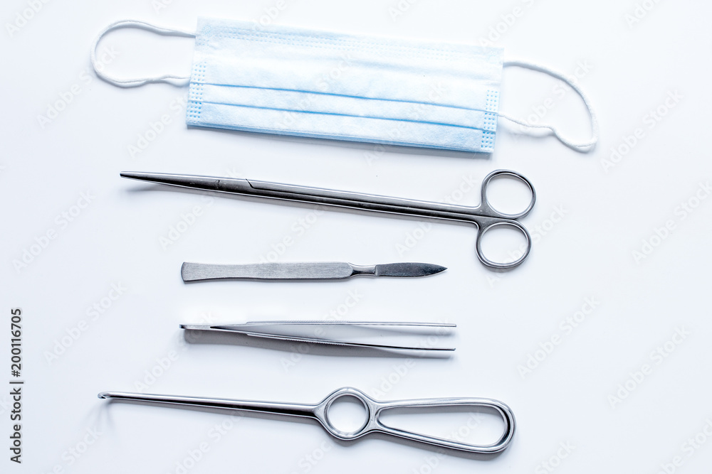 instruments for plastic surgery on white background top view instruments for plastic surgery on white background top view