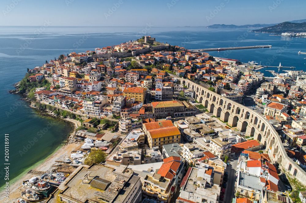 Fototapeta premium Aerial view the city of Kavala in northern Greek, ancient aqueduct Kamares, homes and medieval city wall