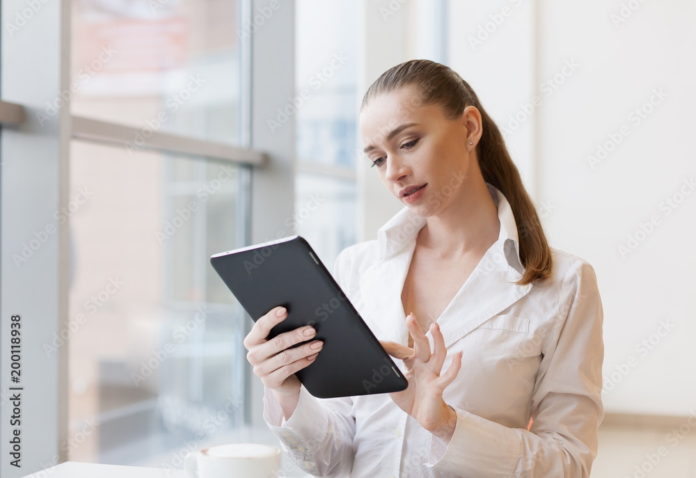 White blouse, tablet, serious White blouse, tablet, serious