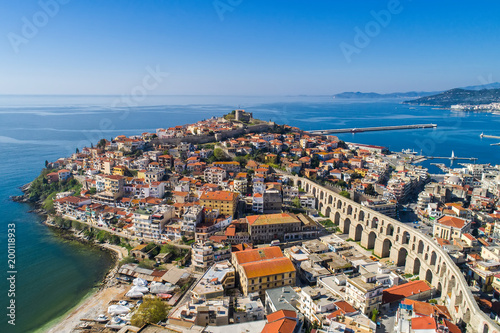 Aerial view the city of Kavala in northern Greek, ancient aqueduct Kamares, homes and medieval city wall photo