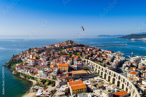 Aerial view the city of Kavala in northern Greek, ancient aqueduct Kamares, homes and medieval city wall photo