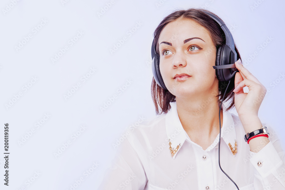 Office work. Portrait of happy smiling cheerful support phone operator in headset on white background. Office work. Portrait of happy smiling cheerful support phone operator in headset on white background.
