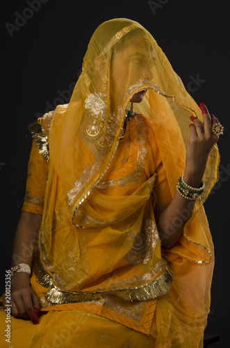 Young woman in bridal costume and jewelry, india