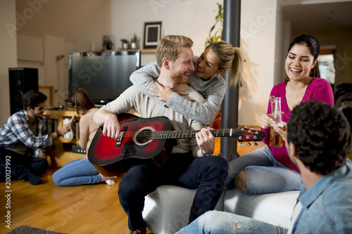 Friends having fun with guitar