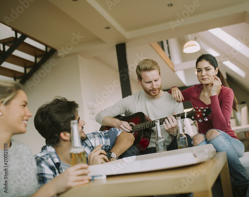 Friends having fun with guitar