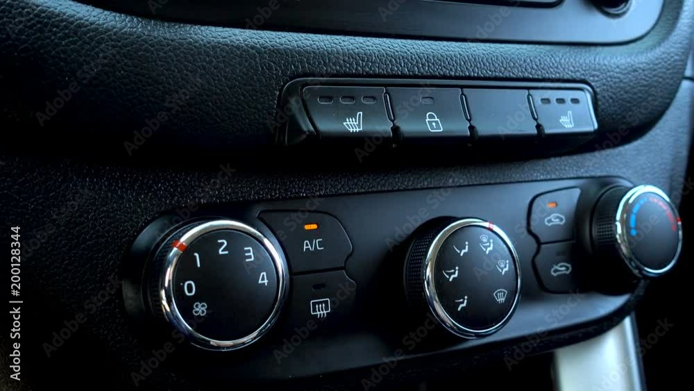 Heated seats in car button. Closeup. Heated Seat dashboard in a car. Heated seats in car button. Closeup. Heated Seat dashboard in a car.