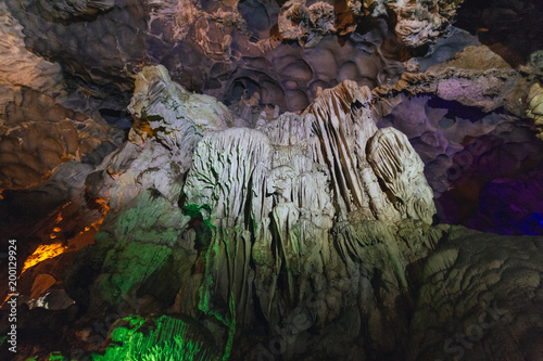 Inside Dong Thien Cung Cave that decorated with artificial colourful lights at Ha Long Bay. Quang Ninh, Vietnam.