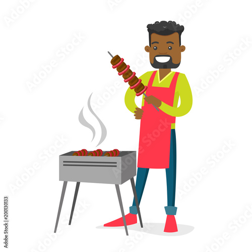 Young cheerful african-american man cooking shashlik with vegetables and meat on skewers on the barbecue grill outdoors. Vector cartoon illustration isolated on white background. Square layout.
