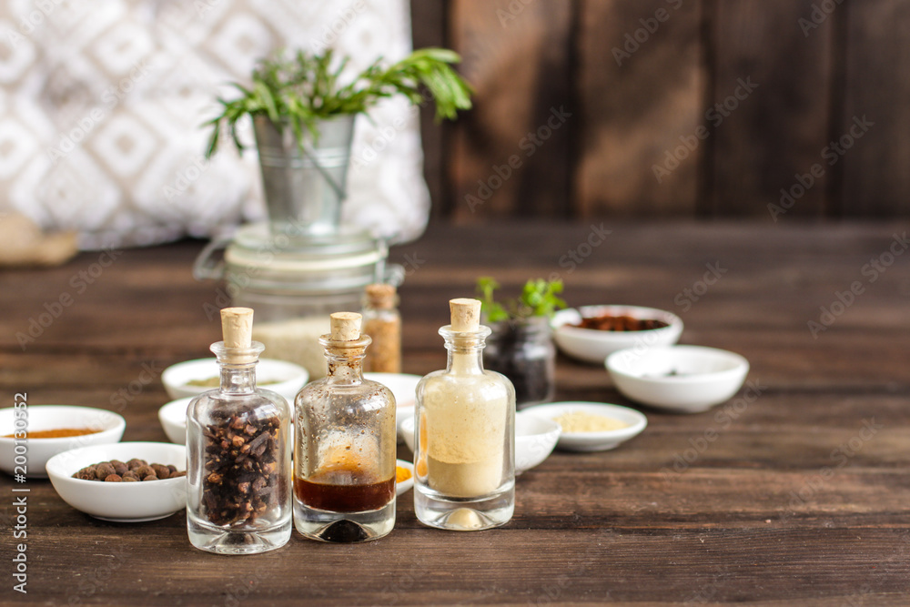 Spices and herbs. Variety of spices and herbs on a wooden surface