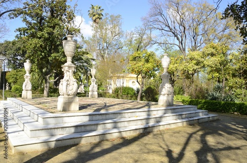 Stone architectural columns in park of Seville, Spain