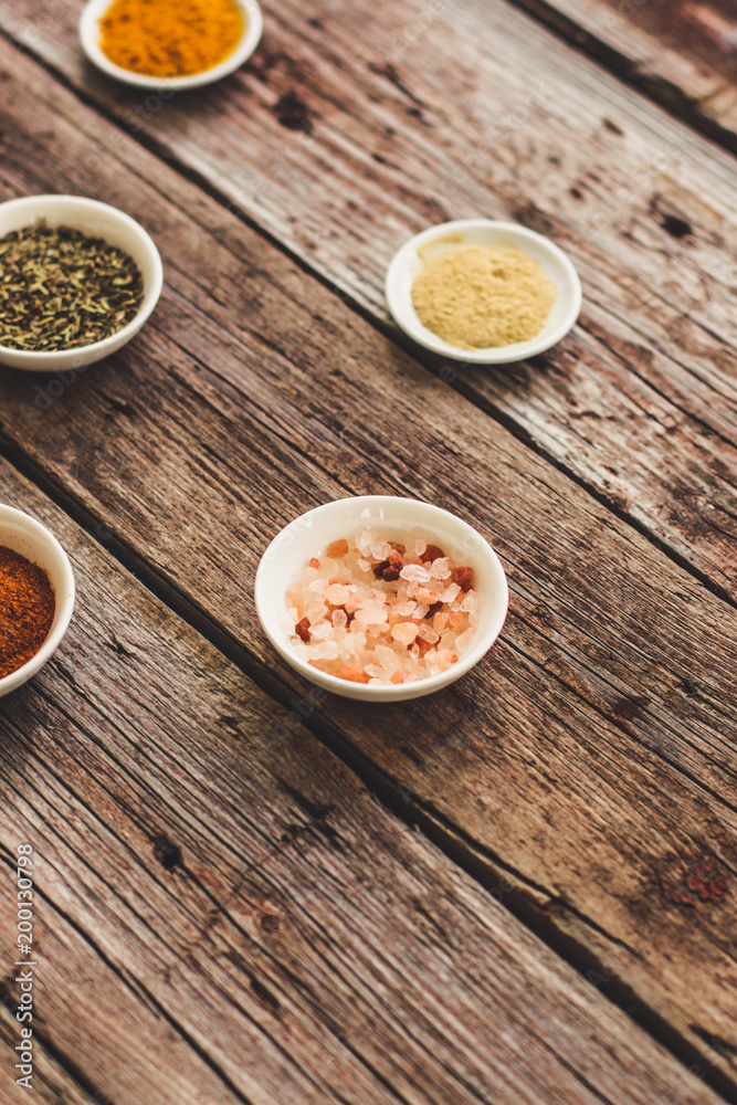 Spices and herbs. Variety of spices and herbs on a wooden surface Spices and herbs. Variety of spices and herbs on a wooden surface