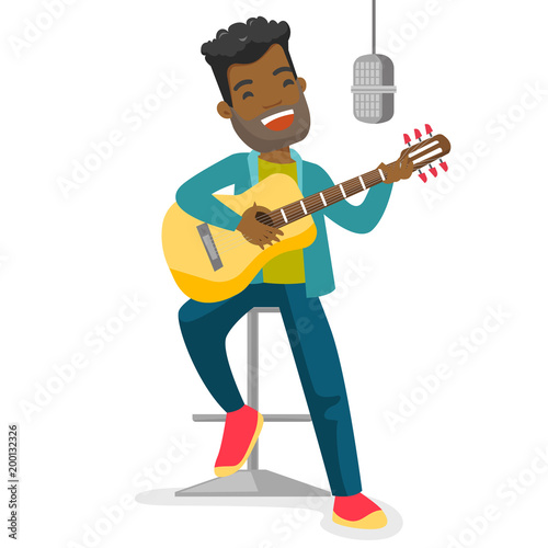 Young african-american male singer playing guitar