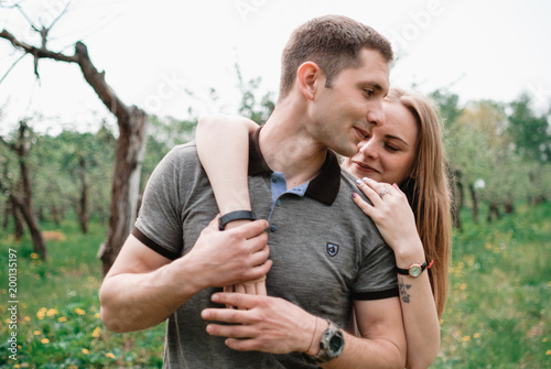 Nice outdorr portrait of young beautiful couple in love photo