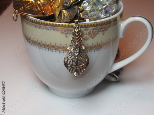 vintage jewelry and a tea cup