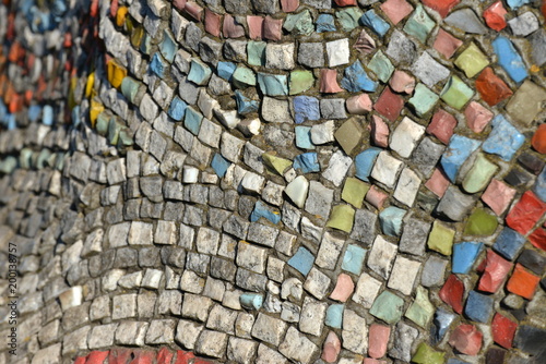 The texture of the mosaic is laid out of small pebbles.