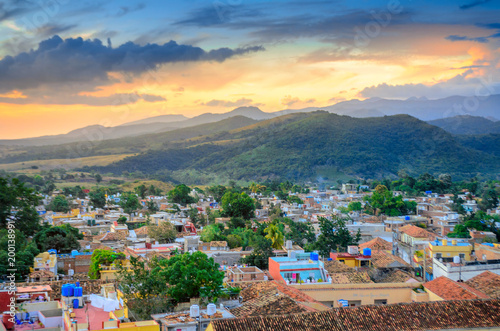 Photography beautiful cozy city surrounded by mountains at sunset