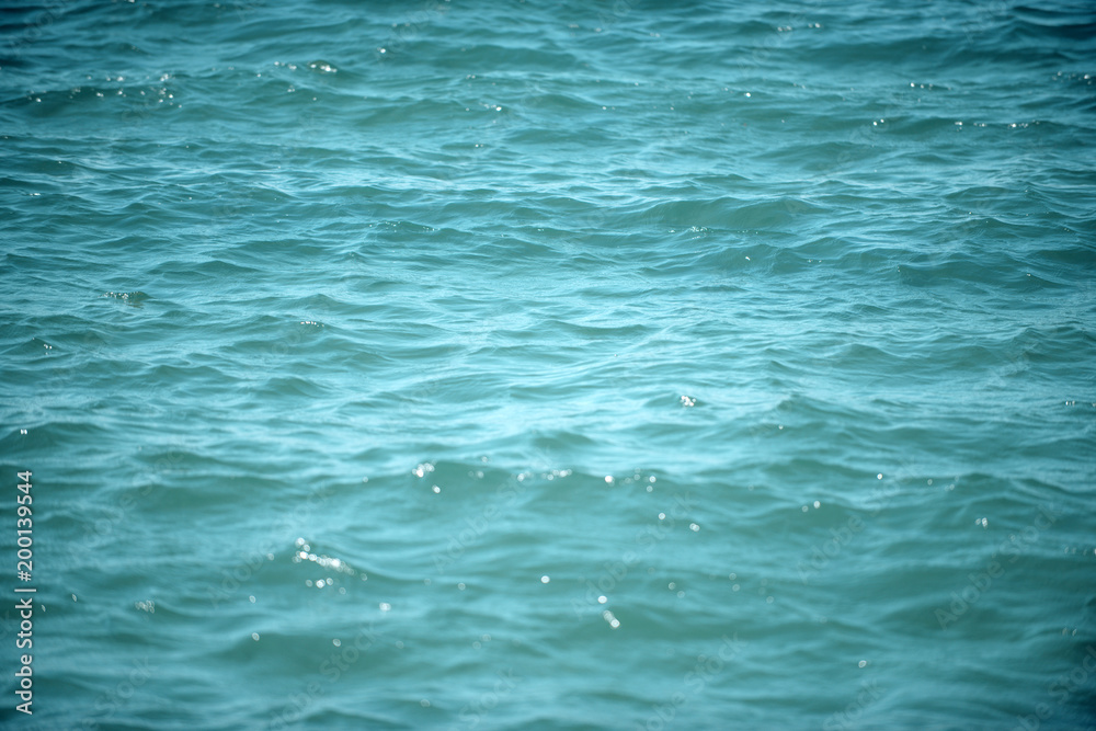 Texture of shining sea surface with waves. Beautiful background, sparkling, shimmering. Sea, ocean water texture. Background concept. Texture of shining sea surface with waves. Beautiful background, sparkling, shimmering. Sea, ocean water texture. Background concept.