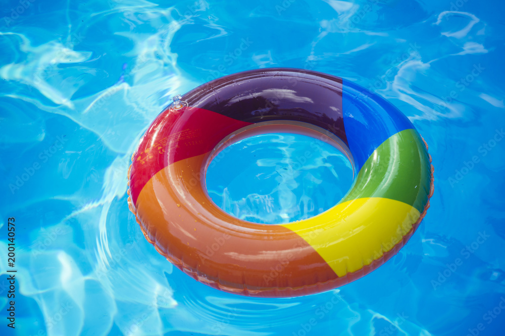 Premium Photo | Fun in the Blue Water. A Yellow Swimming Pool Ring Float  Concept for Summer and Pool Party,