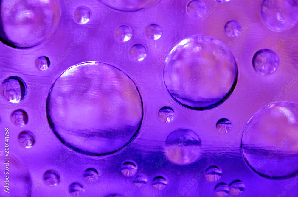 Abstract purple colored glass texture background close up.Interior wall decoration.Selective focus. Abstract purple colored glass texture background close up.Interior wall decoration.Selective focus.