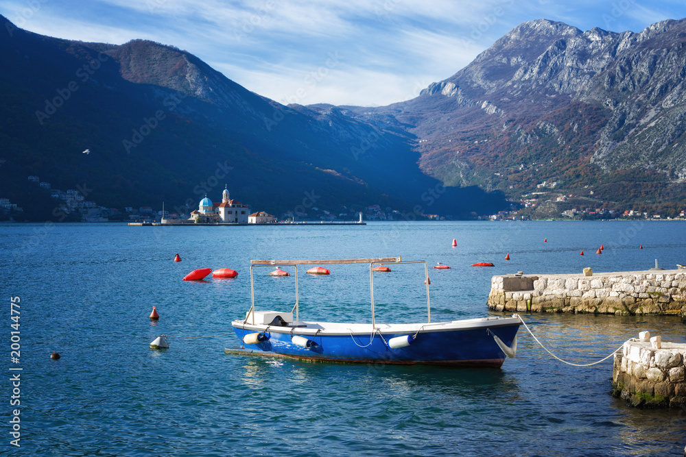 Boat on the background of St.George Island in Perast, Montenegro