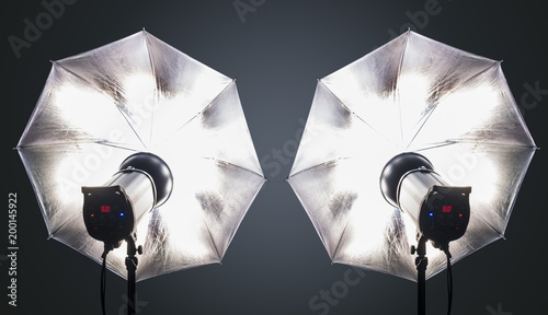 Photo studio strobe flash with umbrellas