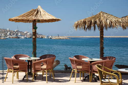 Fototapeta Naklejka Na Ścianę i Meble -  Open cafe on the sea promenade, Montenegro, Bar.