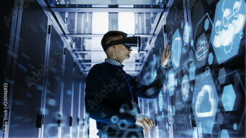 Canvas-taulu IT Engineer Wearing Virtual Reality Headset Works with Augmented Reality Software in Data Center