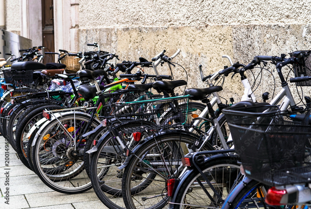 Bicycle parking in one of the medieval streets of Salzburg.