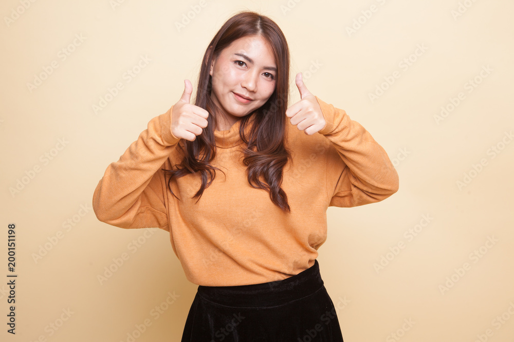 Young Asian woman show two thumbs up. Young Asian woman show two thumbs up.