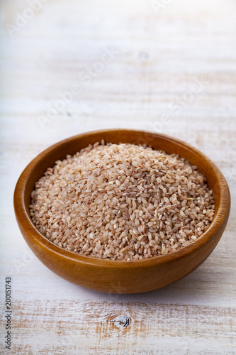 Raw pink rice in a bowl