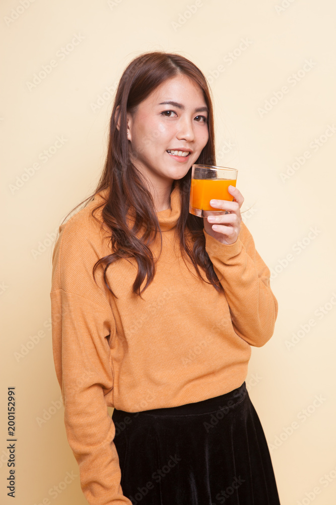 Young Asian woman drink orange juice. Young Asian woman drink orange juice.