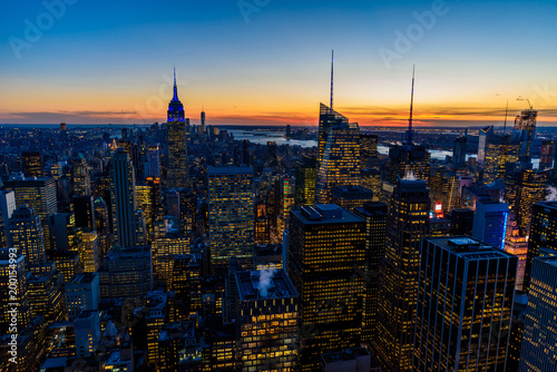 New York City skyline at night - skyscrapers of midtown Manhattan with Empire State Building at Amazing Sunset - USA © Simon Dannhauer