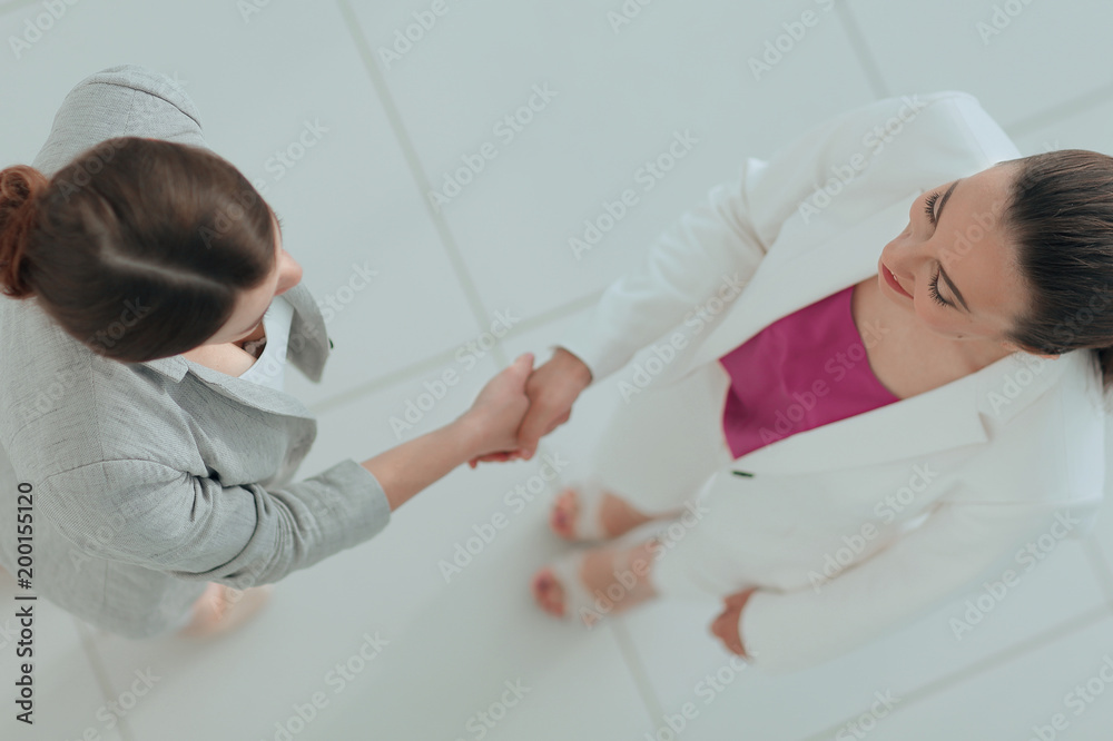 Obraz premium view from the top. handshake elegant business women