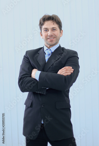 Portrait of happy smiling young businessman