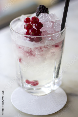 Cocktail with blueberries and ice cubes