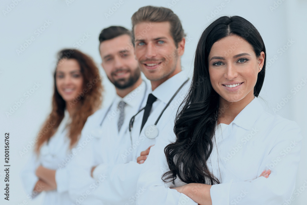 woman doctor on the background of colleagues woman doctor on the background of colleagues
