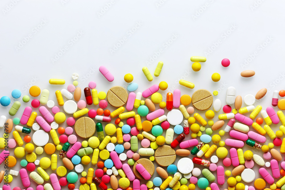 Colorful pills on a light grey background Colorful pills on a light grey background