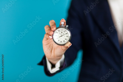 Female hand holding a stopwatch