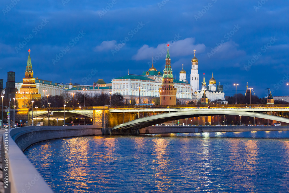 The Moscow Kremlin with night lights on during the evening sunset in the fall