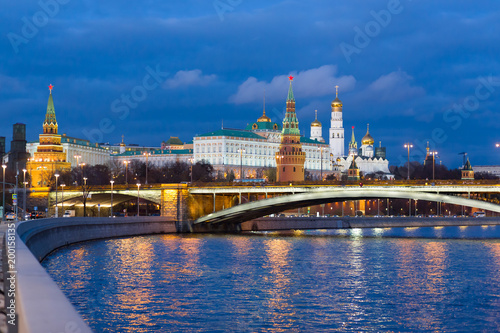 The Moscow Kremlin with night lights on during the evening sunset in the fall
