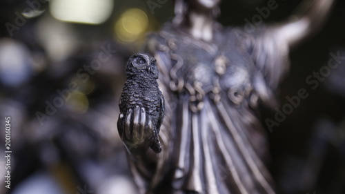 Statue of a woman with an owl