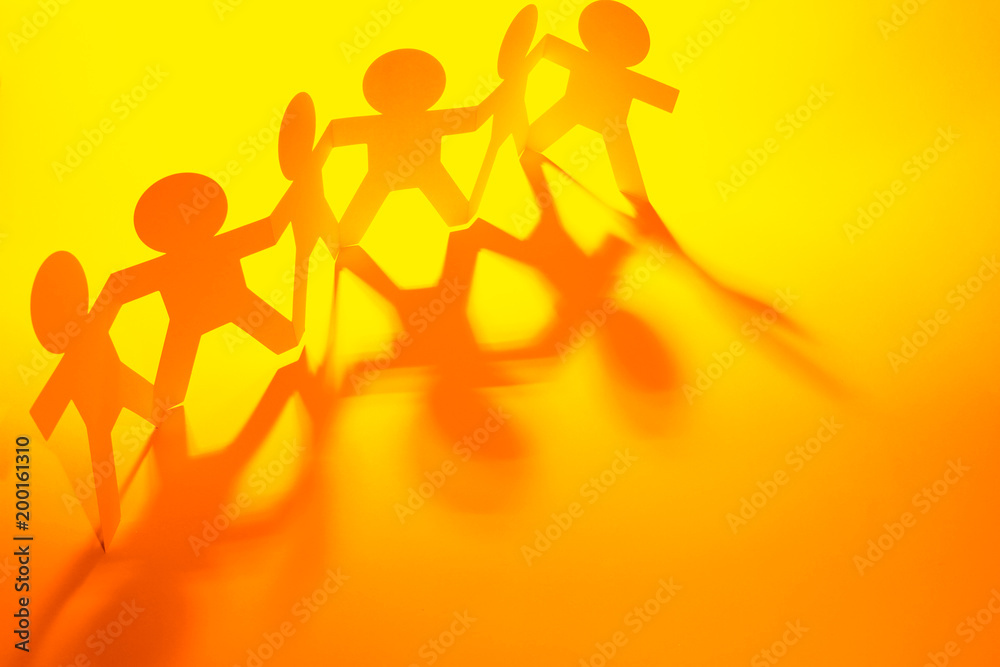 Paper chain team holding hands Paper chain team holding hands