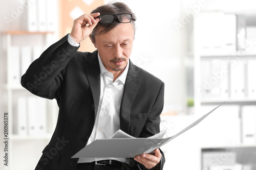 Mature man working with doc...