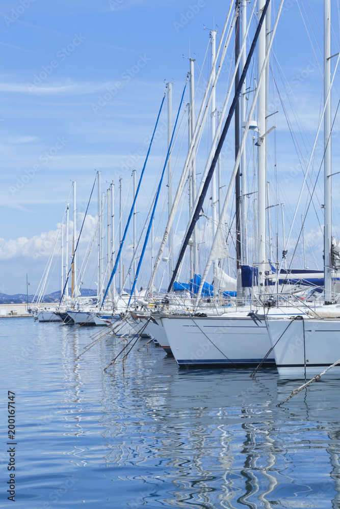 Fototapeta premium Rows of sailing boats in a small Mediterranean sea port .
