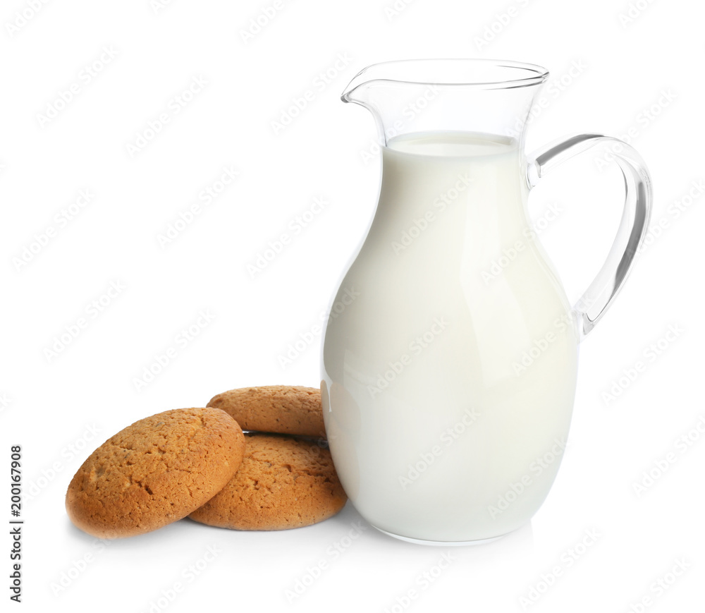 Jug with milk and cookies on white background Jug with milk and cookies on white background