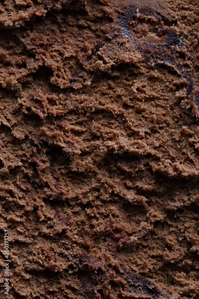 Surface of chocolate ice cream, sweet frozen dessert for summer breakfast. Photographed close-up. Surface of chocolate ice cream, sweet frozen dessert for summer breakfast. Photographed close-up.
