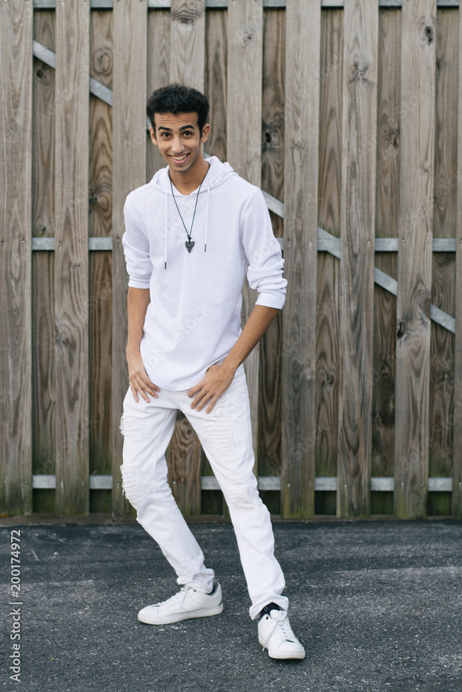 Young Male Model Having Fun in Front of Wooden Wall