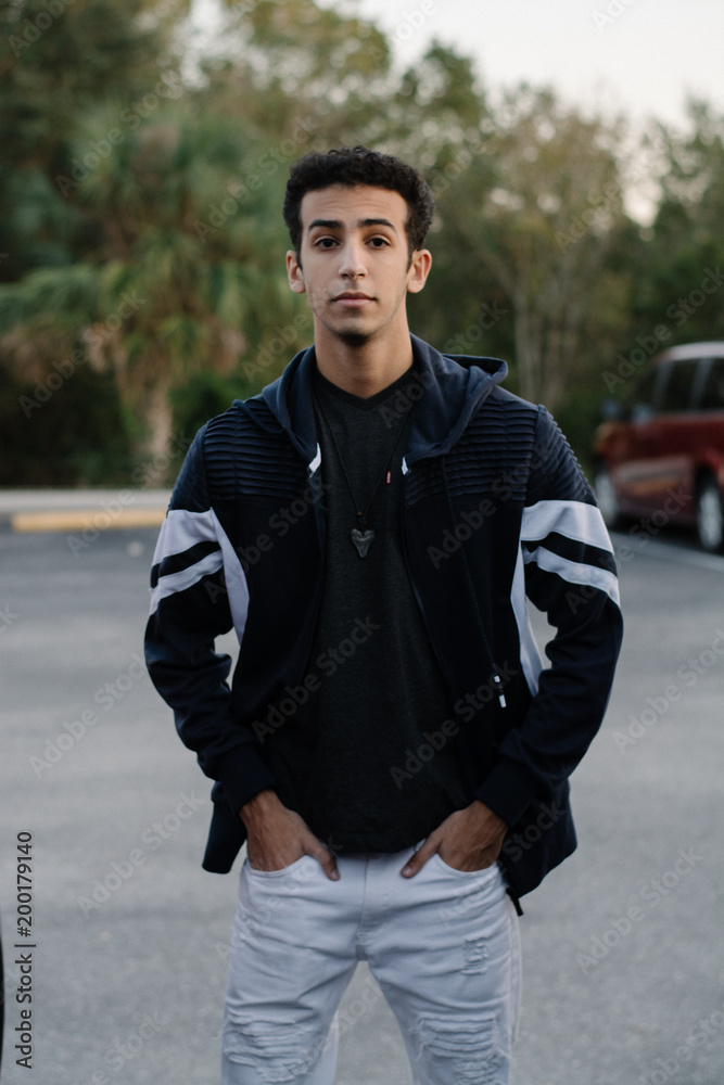 Obraz premium Young Male Modeling in Black and White Jacket