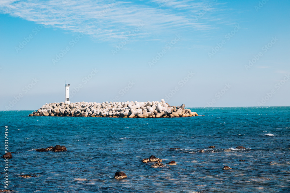 Breakwater and lighthouse at Jeongja harbor in Ulsan, Korea